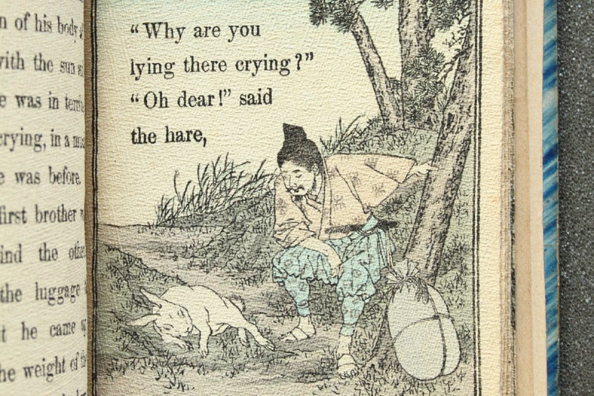 Illustration of man looking at crying rabbit, with words "Why are you lying there crying" "Oh dear" said the rabbit