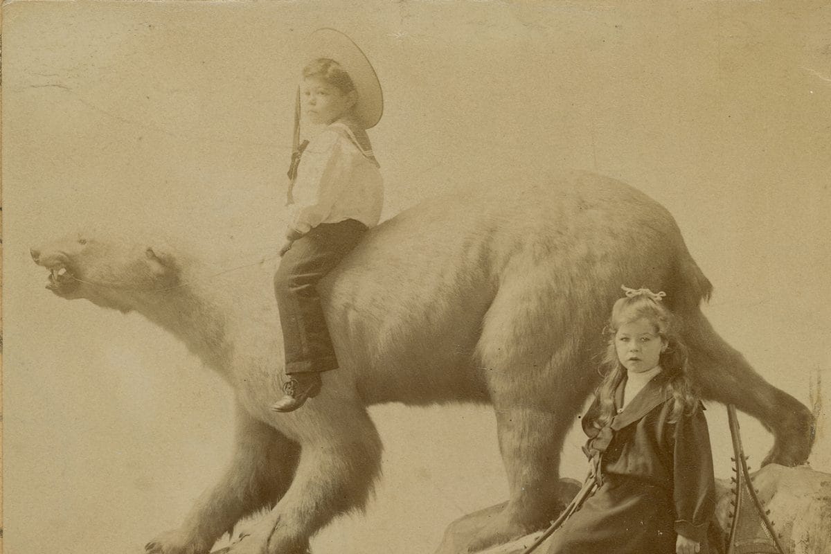 two children on a polar bear