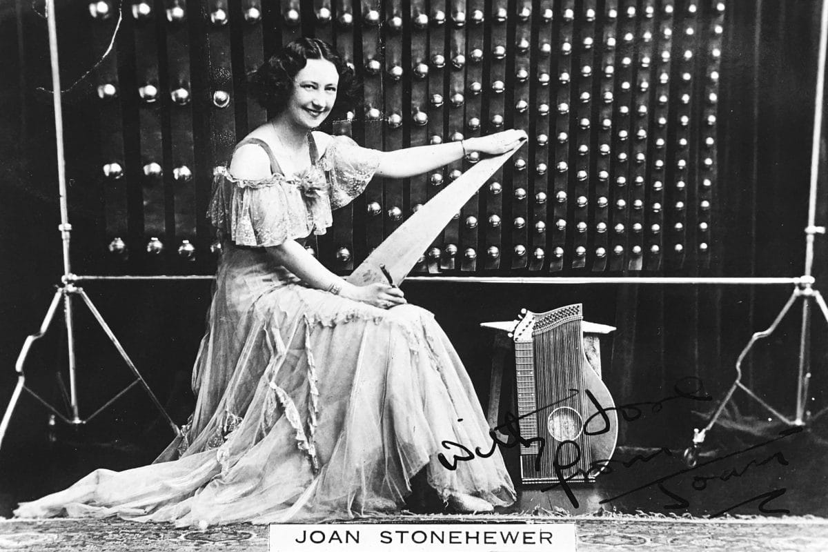 Black and white signed postcard of Joan Stonehewer and her bells