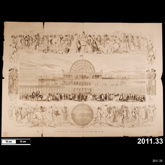 Paper with drawing of glass building with people outside.