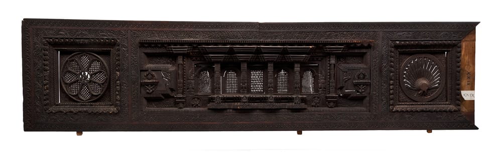 Dark wooden piece of arch