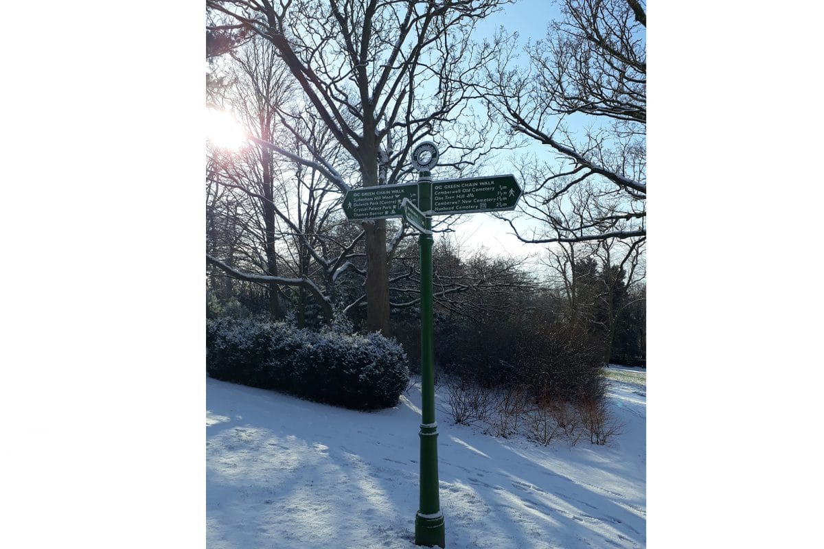 Sign post in Gardens on snowy day