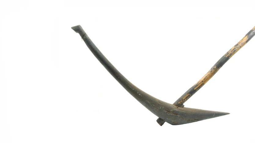 Curved metal shape with long handle