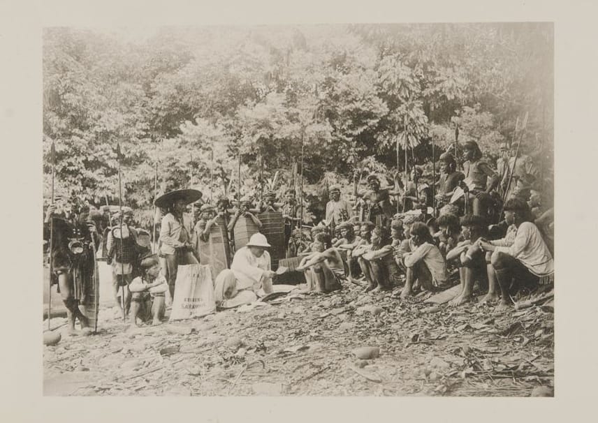 Photo of Charles Hose sitting with Kayan men