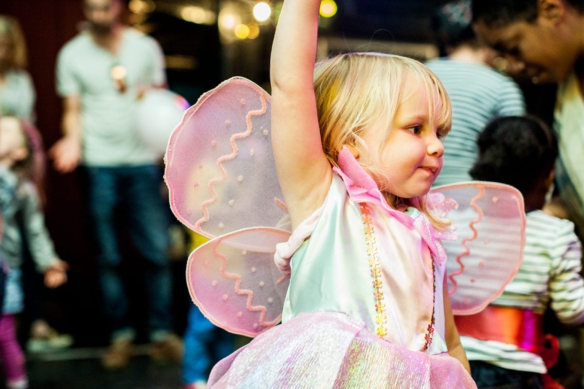 Child wearing butterfly wings
