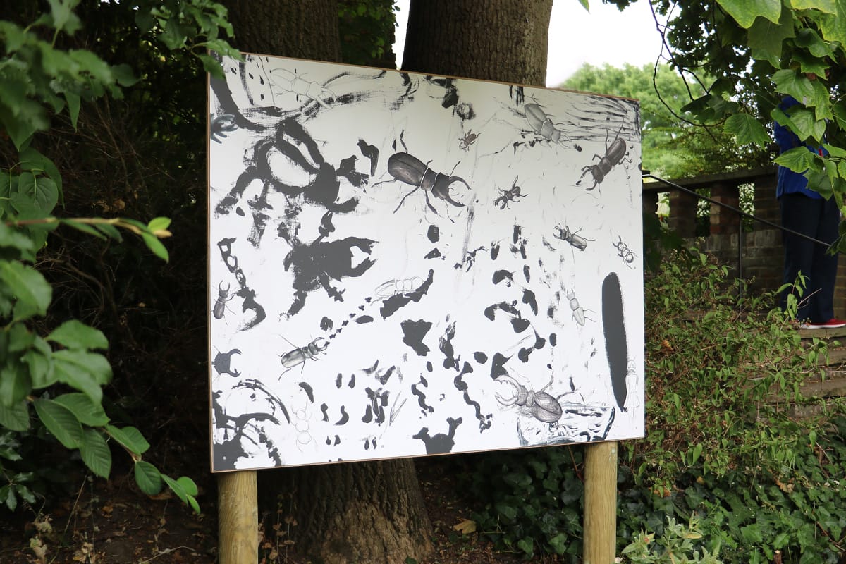 Black and white painting featuring stag beetles on boards in the gardens