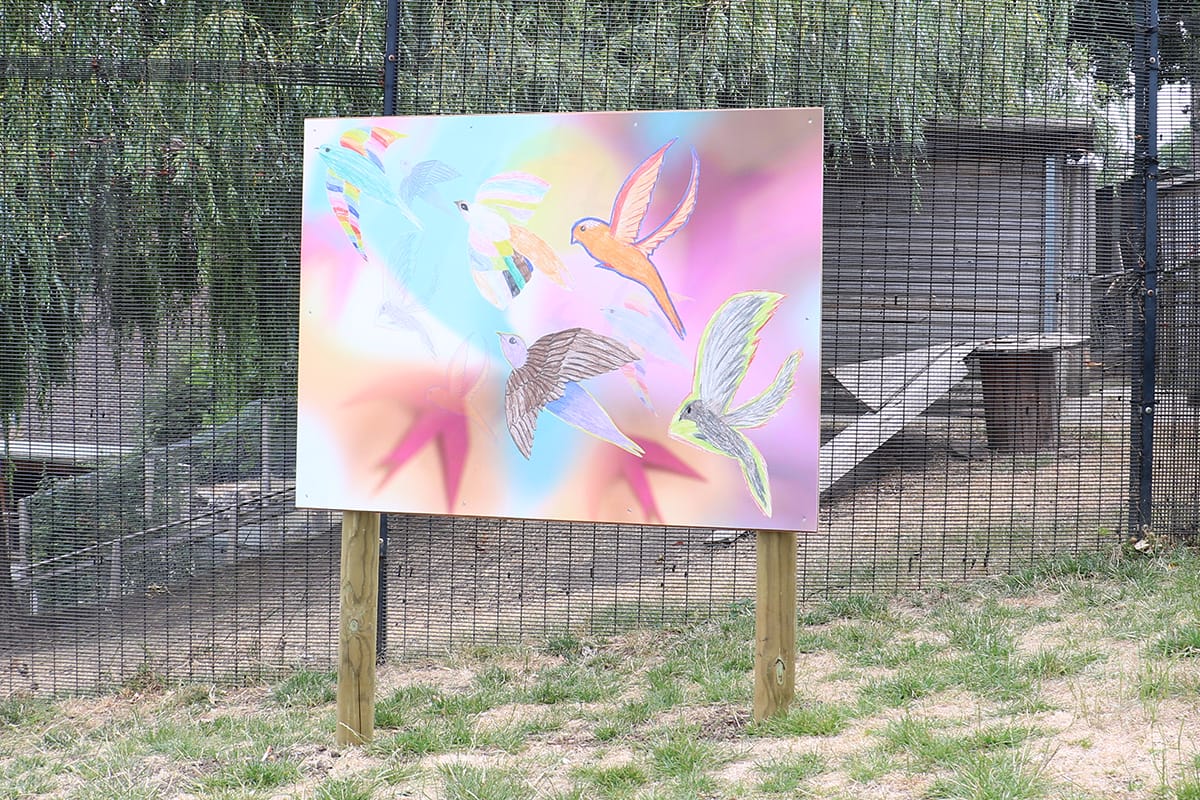 Abstract painting of birdson boards in the gardens