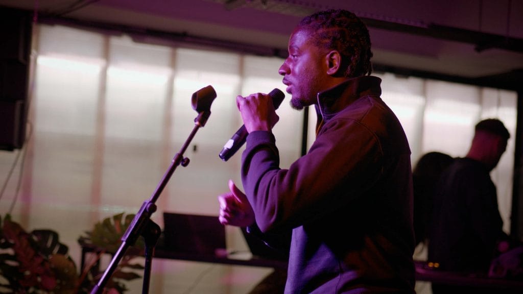 Man speaks into a microphone