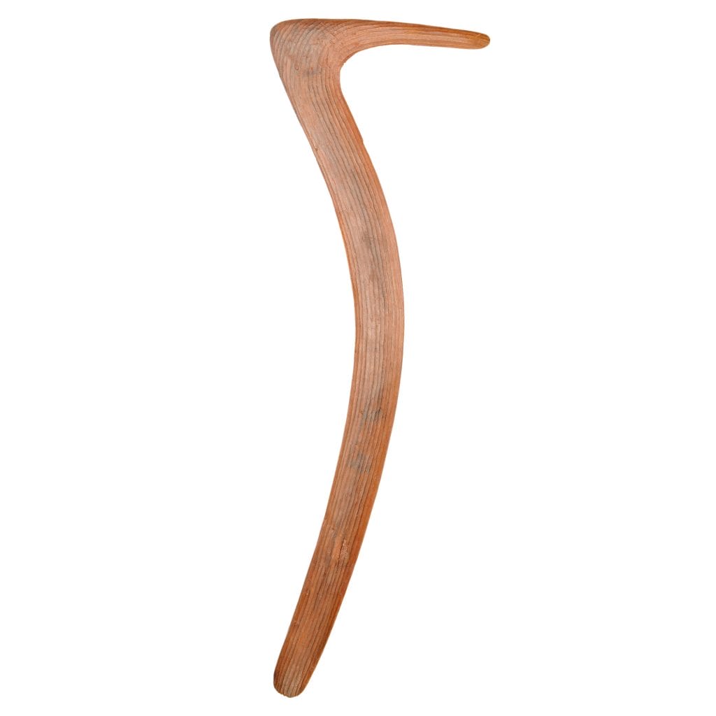 Wooden hooked number 7 boomerang - Warumungu wartilykirri - against a white background