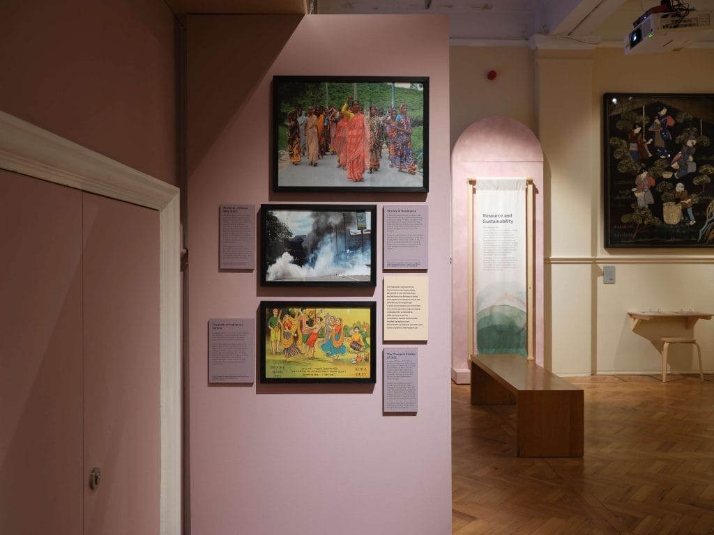 Wall with three framed images on depicting protests and industrial action carried out by tea workers