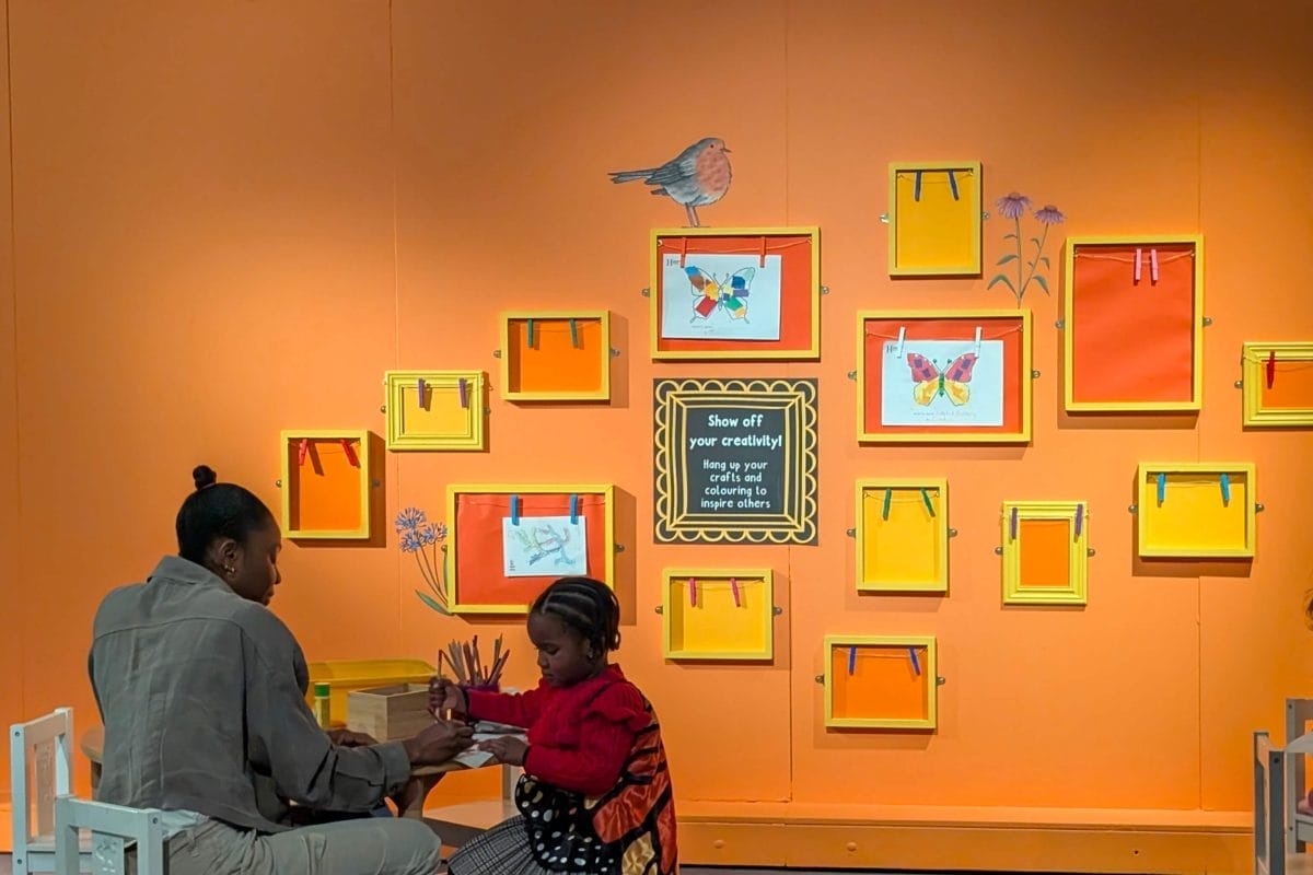 Adult and child do crafts together at a table