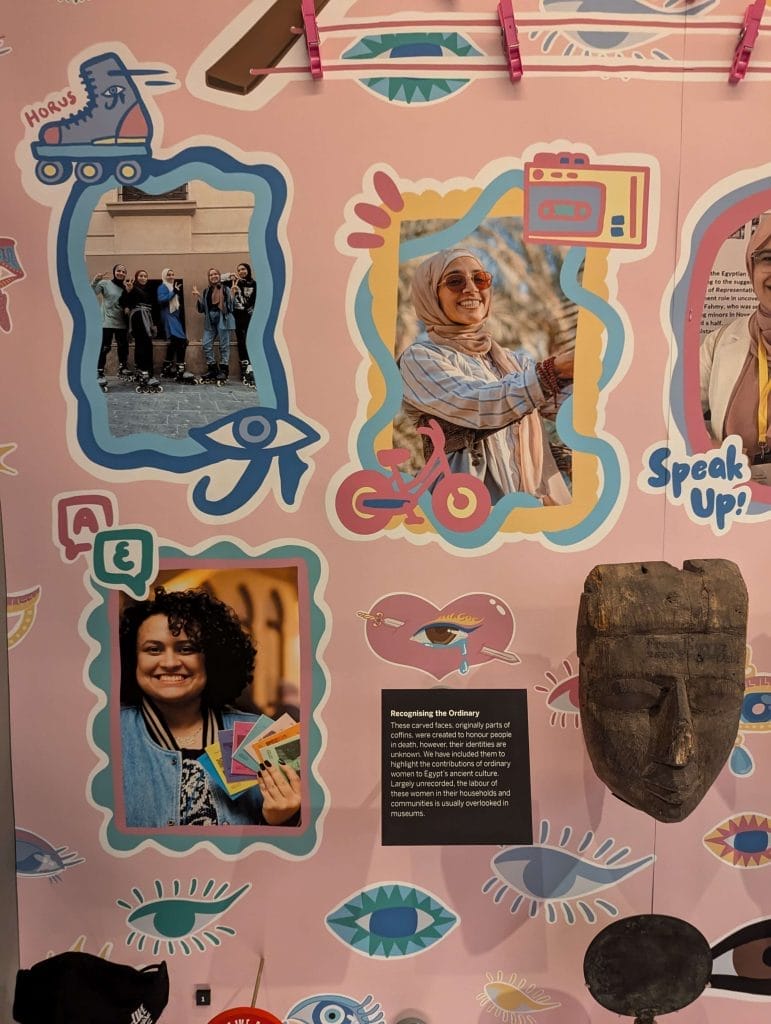 All Eyes on Her display featuring images of contributors set into colourful wallpaper