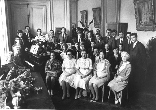 Group shot of musicians mostly seated, including Nadia Boulanger