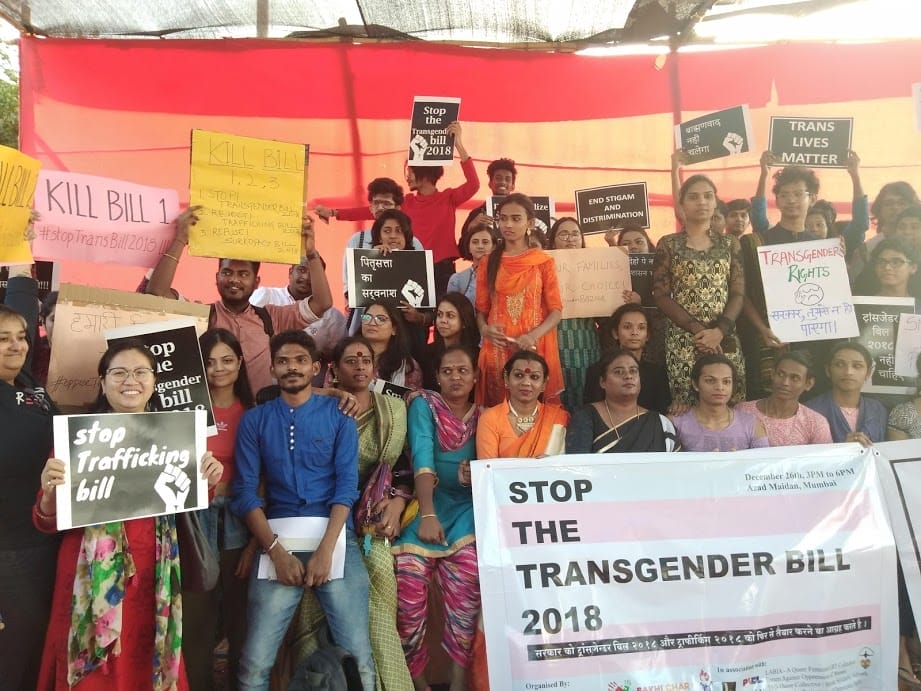 A group of protestors holding signs reading 'stop the transgender bill 2018'