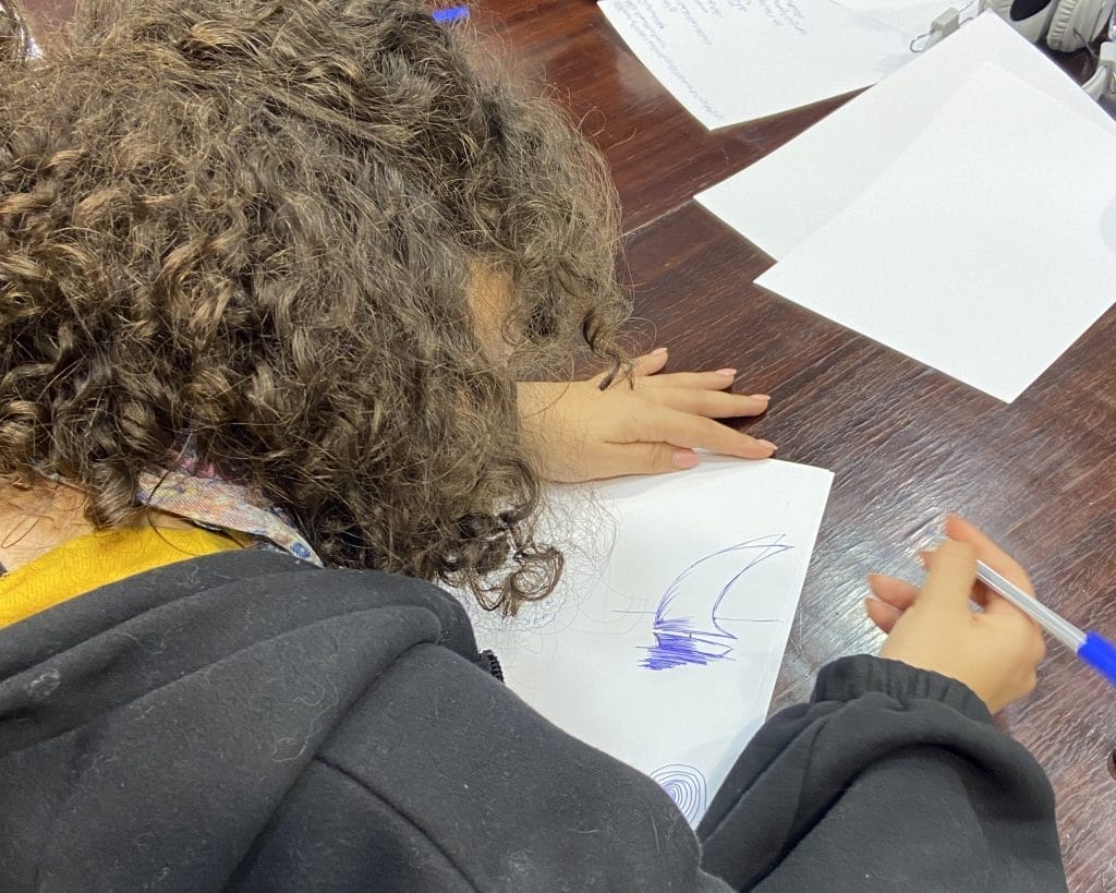 Person writing in a notebook