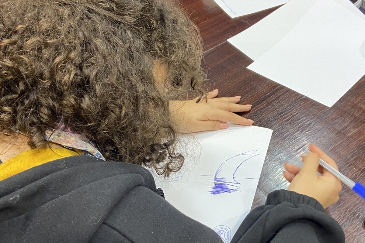 Person writing in a notebook