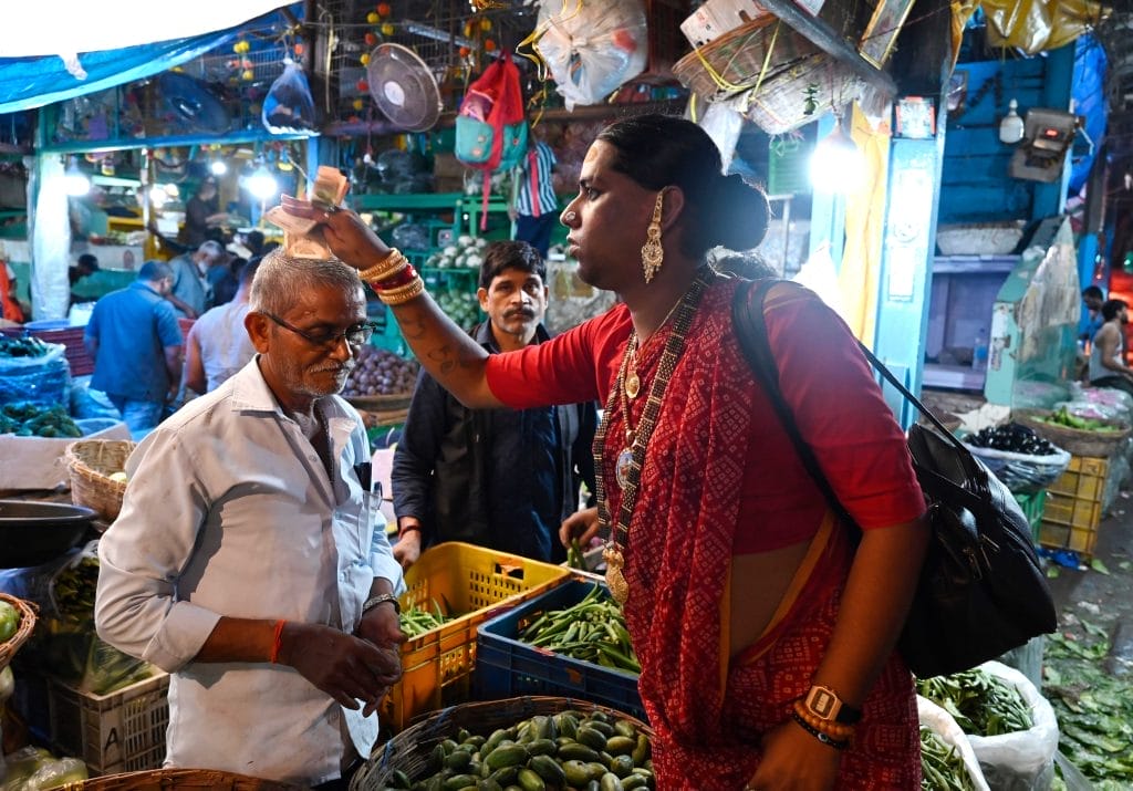 Zoya Thomas lobo giving a blessing to a stallowner in Maheem Market, Mumbai