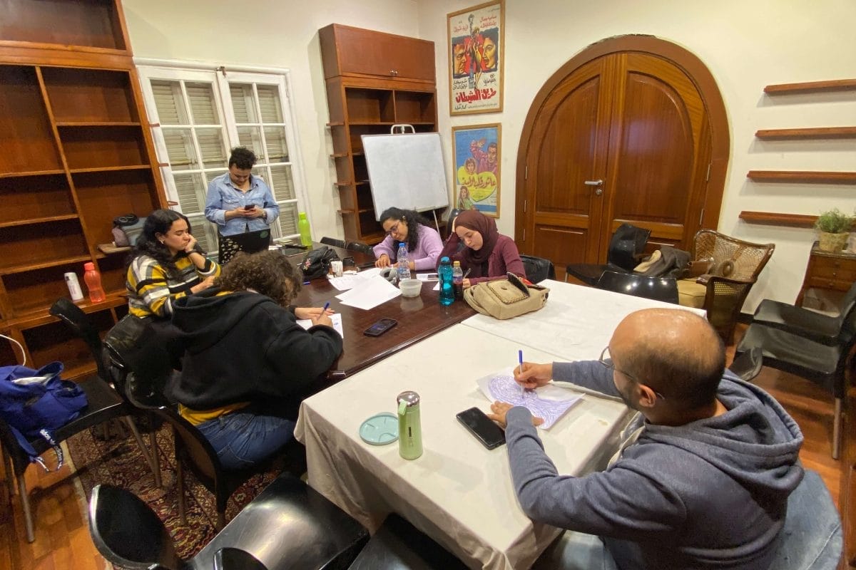 People working on individual work in a small workshop